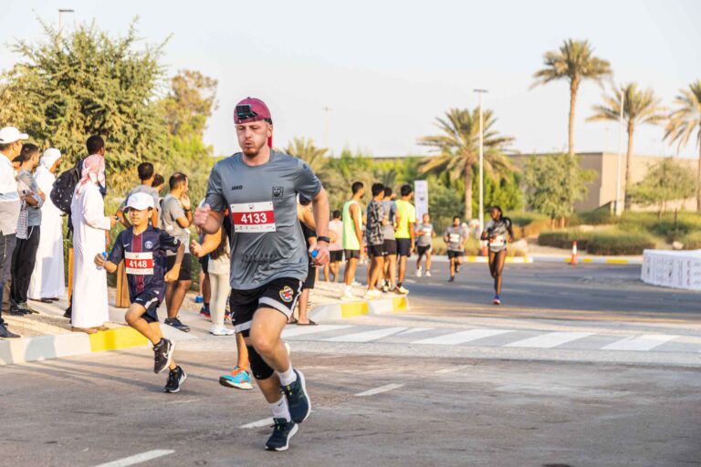 Runners running at Zayed Charity Marathon Abu Dhabi 2022