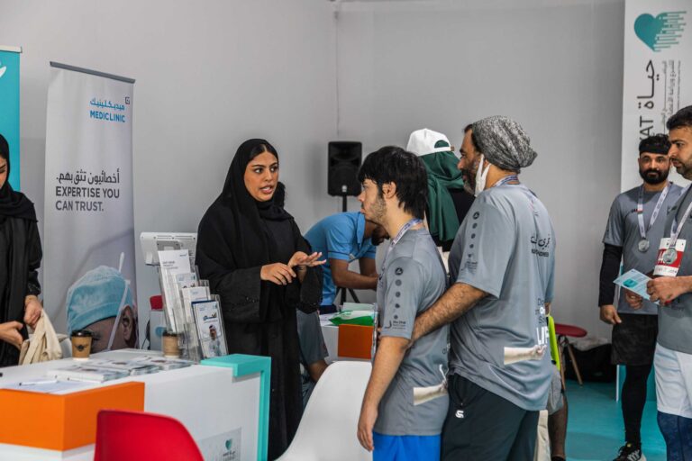 Runners in the Mediclinic booth at the Zayed Charity Marathon Abu Dhabi 2022