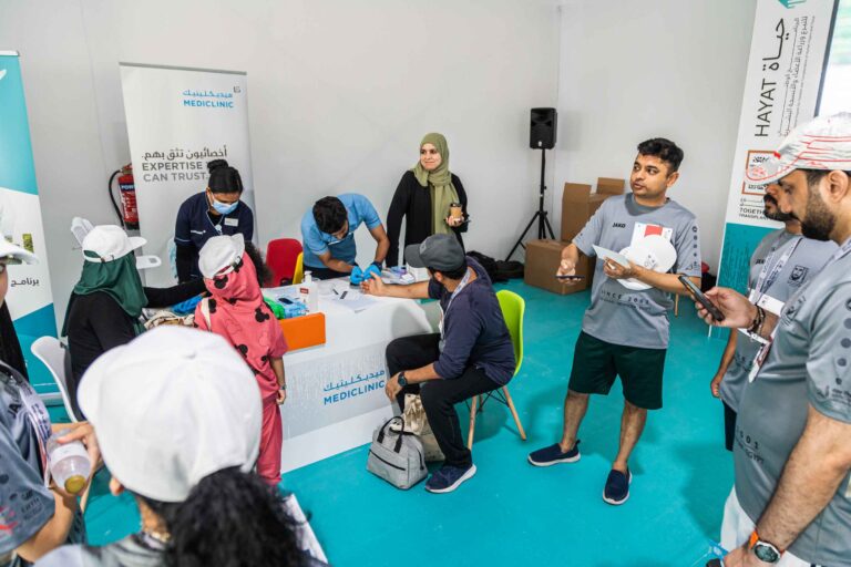 Runner getting vitals checked in the Mediclinic booth at the Zayed Charity Marathon Abu Dhabi 2022