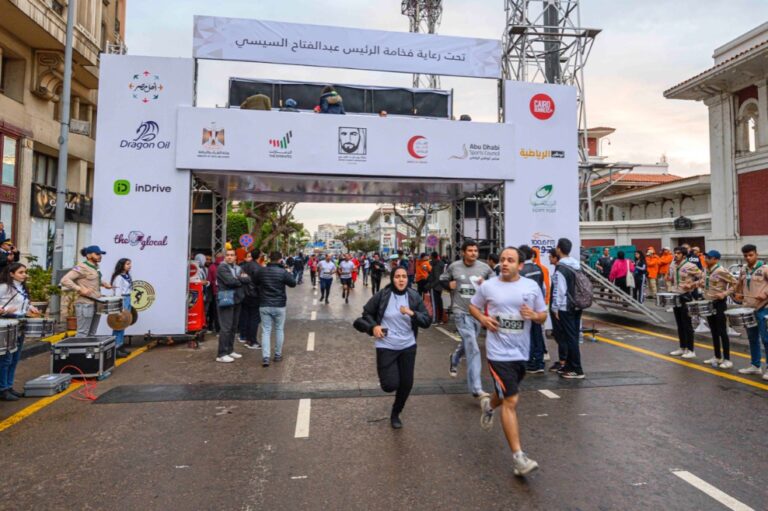 Runners passing through the finish line at Zayed Charity Marathon Egypt 2022